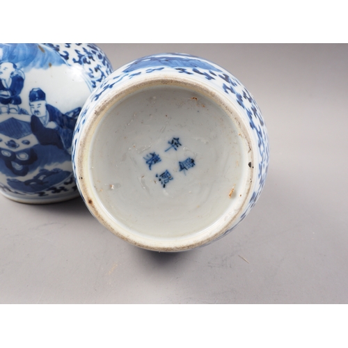 112 - A pair of Chinese blue and white double gourd vases with panelled figure decoration on a flower and ... 