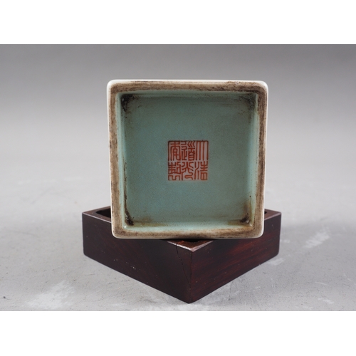 115 - A Chinese porcelain square section brush pot, decorated figures, seal mark to base, 3