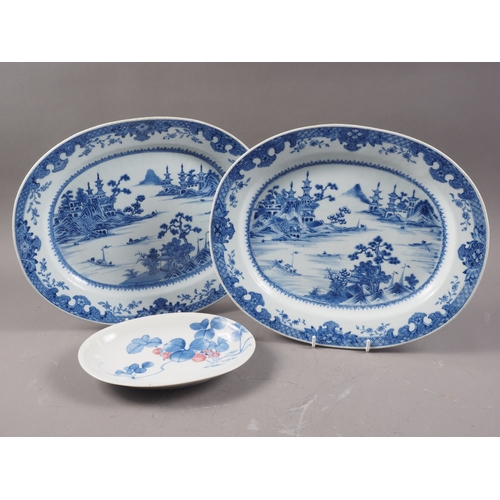 137 - A pair of Chinese oval shaped platters with landscape decoration, 13 1/4