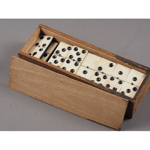 215 - Two sets of bone and ebony dominoes