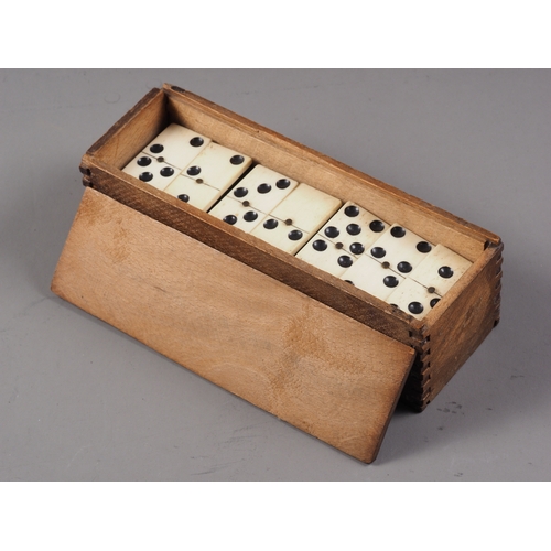 215 - Two sets of bone and ebony dominoes