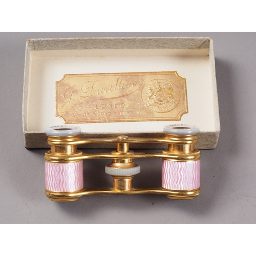 271 - A pair of gilt brass and pink guilloche enamel opera glasses by J Duvelleroy, London, a lorgnette an... 