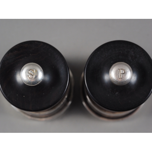 347 - A pair of ebonised and silver mounted salt and pepper grinders