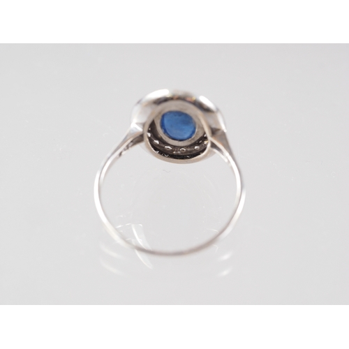 366 - A white metal, sapphire cabochon and diamond set cluster ring, size S natural fault