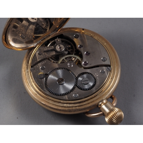 371 - A Record rolled gold cased full hunter pocket watch with white enamel dial and Roman numerals, and a... 