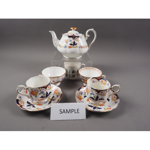 38 - Four Royal Crown Derby cups and saucers, two plates, a Royal Albert 