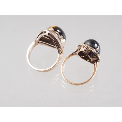 403 - A 9ct gold and tiger's eye dress ring, size N, 7.1g, and another similar, size M, 5.4g