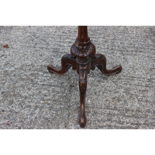 488 - A late 19th century carved walnut and parquetry shape top work table with part fitted interior, on t... 