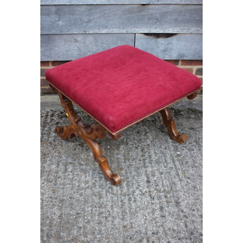 490 - An early 19th century carved walnut 'X' frame stool, upholstered in a red velour, 22