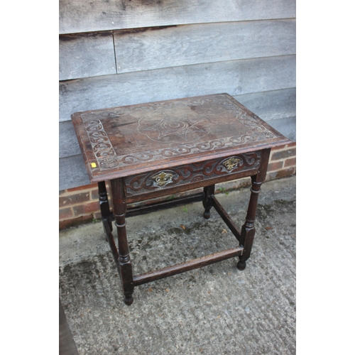 493 - An 18th century provincial carved oak side table, fitted one drawer, on turned and stretchered suppo... 