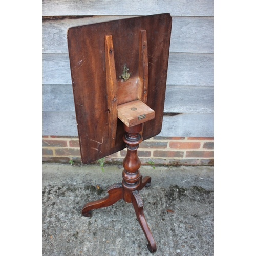 496 - A 19th century walnut rectangular tilt top occasional table, on tripod splay supports, 24