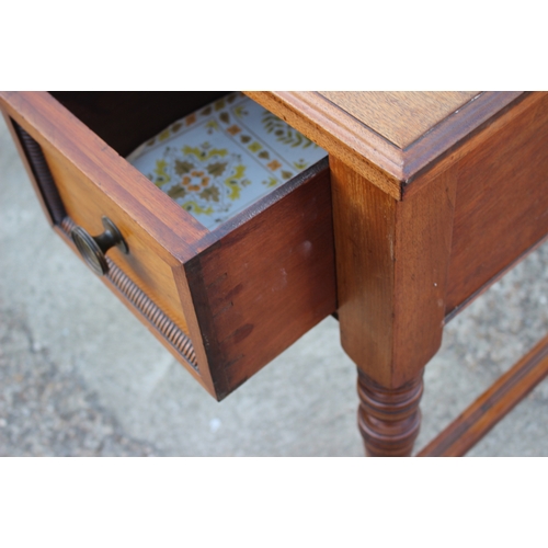 497 - A late 19th century oak break bowfront desk with tooled leather top over three drawers, on turned an... 