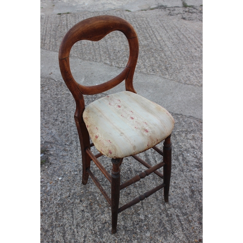 498 - A 19th century carved mahogany shape back side chair and a child's deportment/high chair