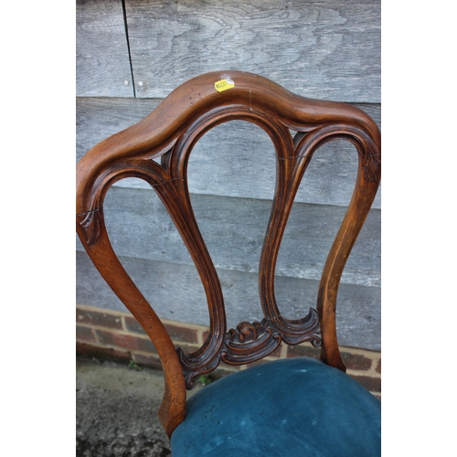 498 - A 19th century carved mahogany shape back side chair and a child's deportment/high chair