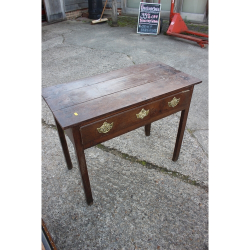 502 - A Georgian provincial side table, fitted one drawer, on champhered supports, 36