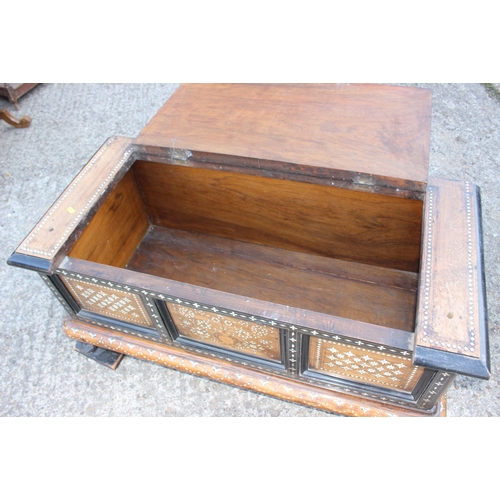 503 - An antique Anglo Indian bone and brass inlaid chest with triple panel front carved tortoise supports... 