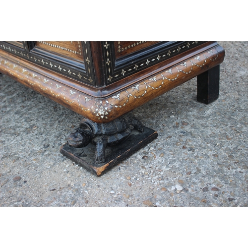 503 - An antique Anglo Indian bone and brass inlaid chest with triple panel front carved tortoise supports... 