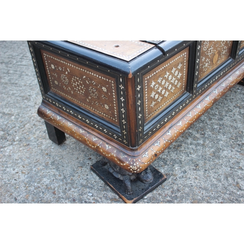 503 - An antique Anglo Indian bone and brass inlaid chest with triple panel front carved tortoise supports... 