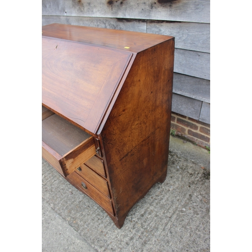 511 - A Georgian mahogany fall front bureau, the interior fitted pigeonholes and drawers over four long gr... 