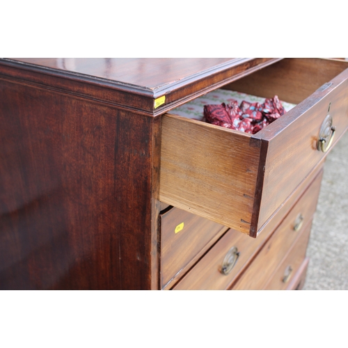 514 - A late Georgian mahogany chest of two short and four long graduated drawers with stamped brass handl... 