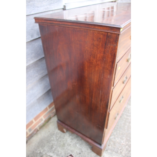 514 - A late Georgian mahogany chest of two short and four long graduated drawers with stamped brass handl... 