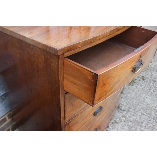 516 - An early 19th century mahogany bowfront chest of two short and three long graduated drawers with sta... 