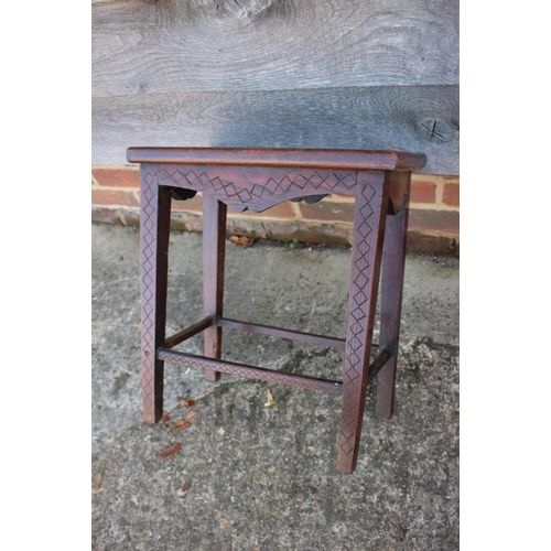 533 - A 19th century carved oak stool/occasional table, on square taper supports, inscribed EH 1859, 17