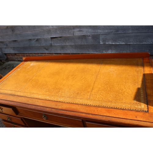 537 - A late 19th century mahogany double pedestal desk with tooled leather top over nine drawers, 52