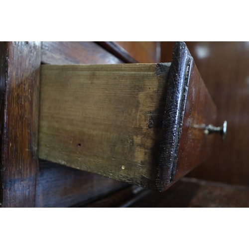 540 - An early 19th century oak and mahogany banded dresser, the upper section fitted open shelves with fl... 