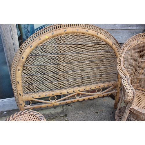 570 - A rattan peacock chair with matching stool and headboard, chair 46