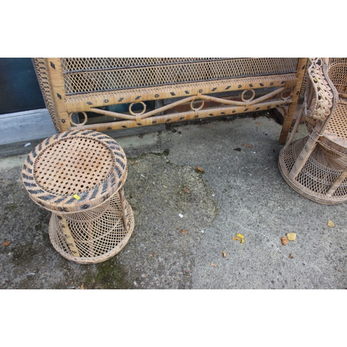 570 - A rattan peacock chair with matching stool and headboard, chair 46