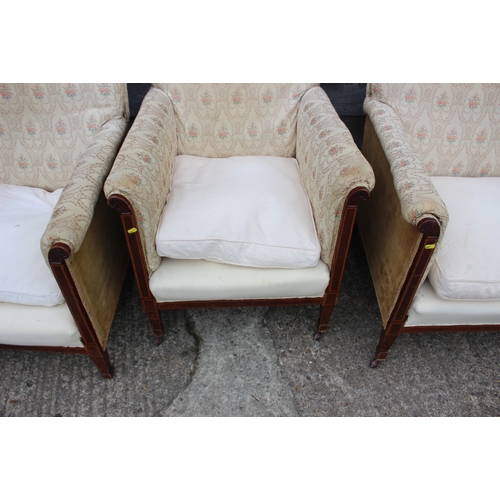 573 - An Edwardian mahogany and line inlaid two-seat settee with loose cushions, on slender supports,  a p... 