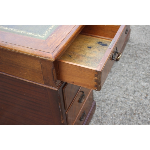 591 - A partners figured mahogany double pedestal desk with triple panel tooled leather top over nine draw... 