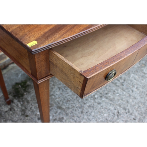 603 - A bowfront side table, fitted three drawers, on square taper supports, 36