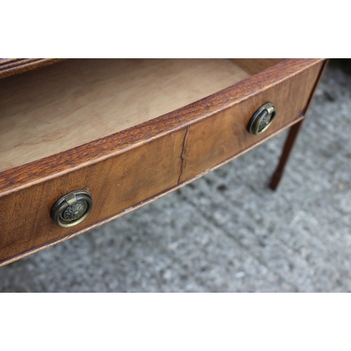 603 - A bowfront side table, fitted three drawers, on square taper supports, 36