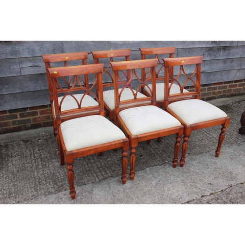 605 - A mahogany and yew wood banded single pedestal extending dining table, 42