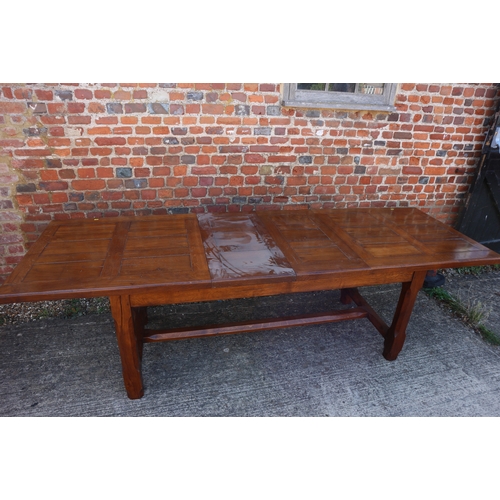 637 - A well reproduced oak refectory dining table with two extra leaves, on champhered and stretchered su... 