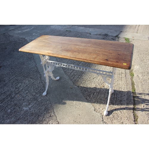 641 - A white painted cast iron framed hall table with mahogany top, 48