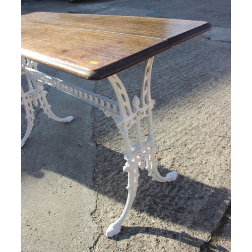 641 - A white painted cast iron framed hall table with mahogany top, 48