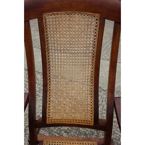 647 - A pair of Edwardian teak and cane seat and back folding steamer chairs