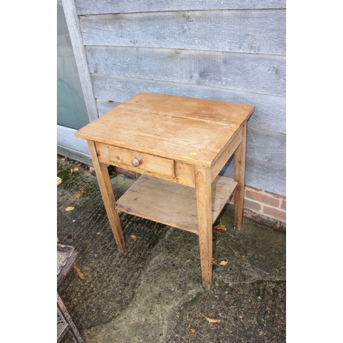 665 - A waxed pine side table, fitted one drawer on turned supports, 28 1/2