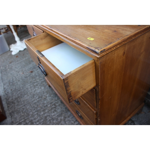 666 - A 19th century waxed pine chest of two short and three long drawers with brass oval handle plates, o... 