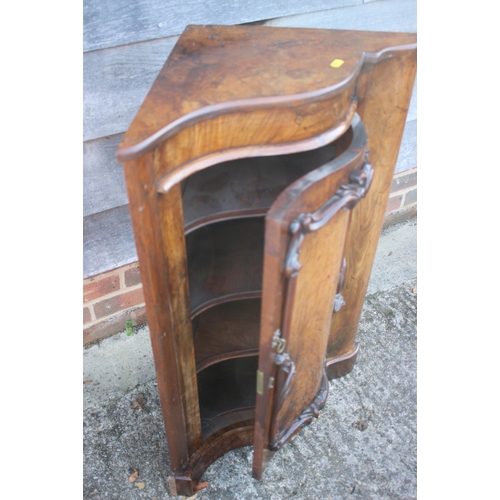 668 - A 19th century walnut shape front corner cupboard enclosed door, on block base, 24