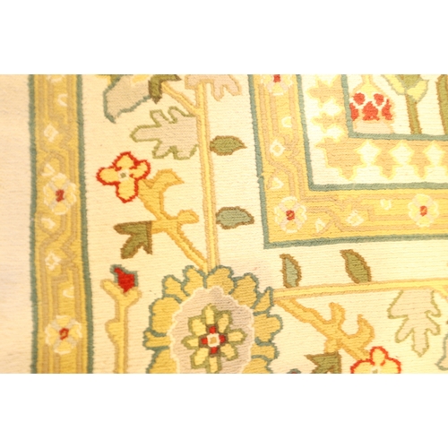 684 - An Indian flat weave/crewelwork carpet with all over geometric design on a cream ground and bird and... 