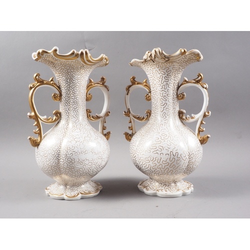 7 - A pair of early 19th century Worcester bulbous flared rim vases with gilt scrolled handles and gilt ... 