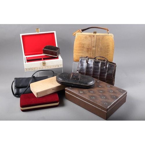 246 - A snakeskin handbag, a crocodile skin handbag and a number of jewellery boxes