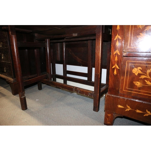 548 - An antique provincial oak drop leaf dining table, on square gate leg supports, 39