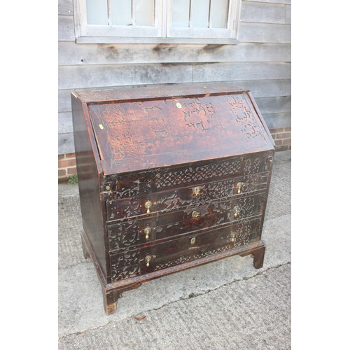 484 - A carved fall front bureau with fitted interior over three graduated drawers on bracket feet, 36