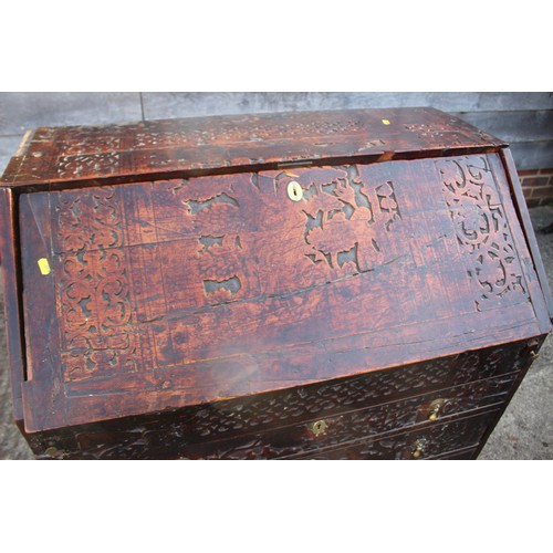 484 - A carved fall front bureau with fitted interior over three graduated drawers on bracket feet, 36