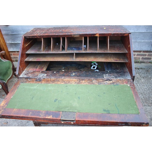 484 - A carved fall front bureau with fitted interior over three graduated drawers on bracket feet, 36